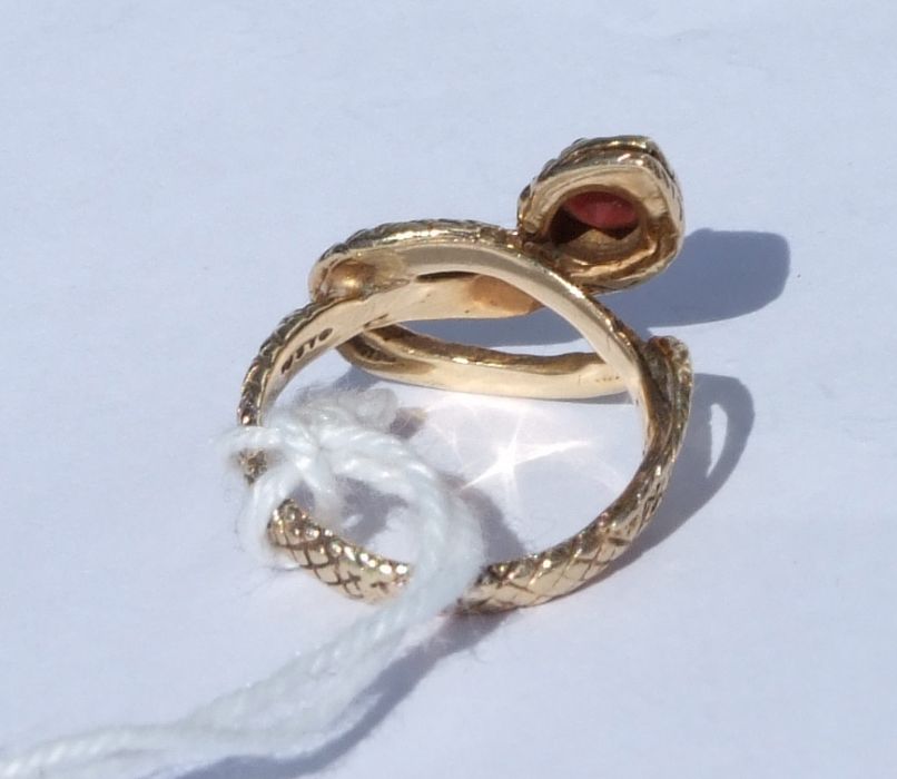 A 14ct gold snake ring set with a single garnet. Approx. UK size I. 3.9gCondition Reportgood - Image 5 of 5