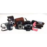A quantity of vintage cameras to include an Eastman Kodak, a Coronet Ambassador, A German Paxette