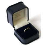 An 18ct gold wishbone ring set with six diamonds, approx UK size 'N', 2.6g.