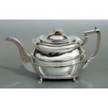 A George III Scottish silver teapot of hemispherical form with gadrooned rim and foot rim, on four