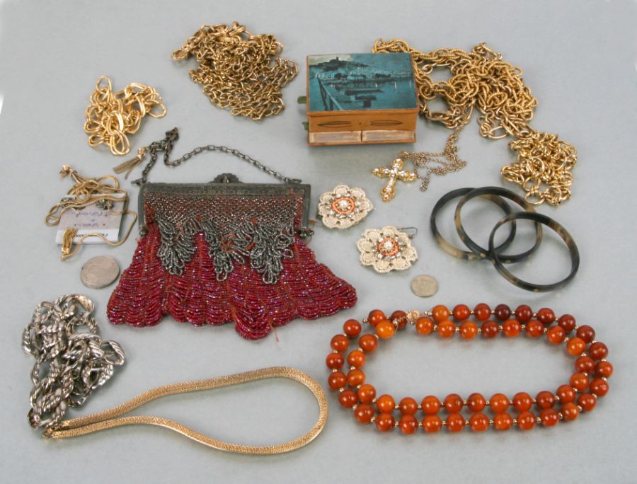 A quantity of costume jewellery to include three tortoiseshell bangles set with yellow metal