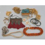 A quantity of costume jewellery to include three tortoiseshell bangles set with yellow metal