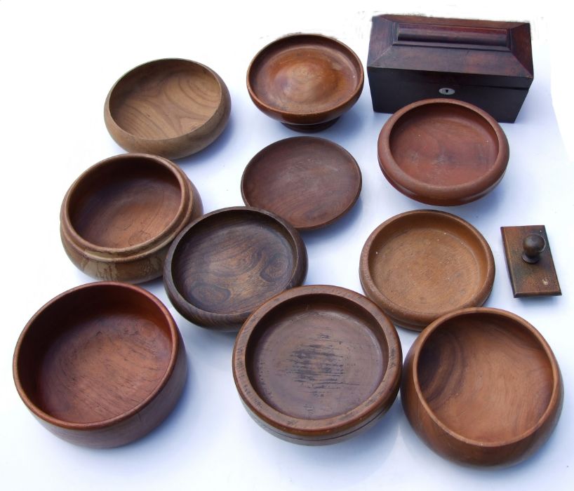 A collection of treen items including a footed bowl, 24cm diameter, another bow,l 23cm diameter,