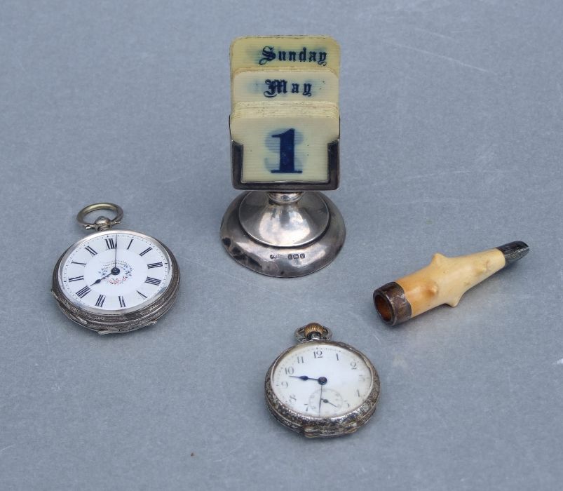 A silver mounted desk calendar, Birmingham 1920; together with two silver cased open faced fob
