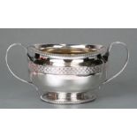 A George III Scottish silver hemispherical sugar basin with loop handles, gadrooned rim and foot rim