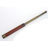 A 19th century brass mounted mahogany two-draw telescope, 37cms long.