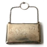 An early 20th century silver purse of rectangular form, the lid with engraved initials, marks