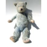 A vintage blue plush teddy bear, approx 52cms high.