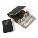 A French "Executiue's Cellaret" comprising of six shot glasses in a faux crocodile skin case, a
