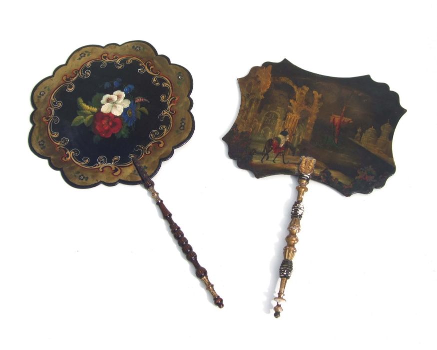 A Victorian papier-mache face shield decorated with a gentleman on horseback in a romantic