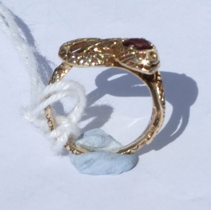 A 14ct gold snake ring set with a single garnet. Approx. UK size I. 3.9gCondition Reportgood - Image 3 of 5