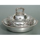 A George IV Scottish silver entrée dish and cover, the cover with cast rim of floral and swag