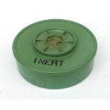 An inert landmine, the reverse impressed 'REMIDS-PP-079', 27cms diameter.