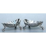 A pair of Victorian silver shell shaped salts stand on ball and claw feet, Sheffield 1870. Each
