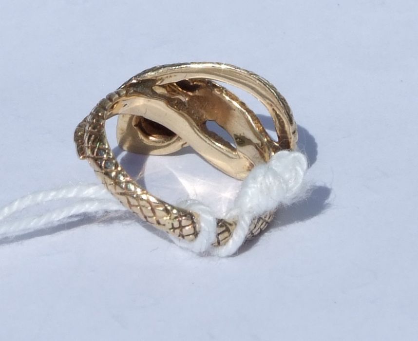 A 14ct gold snake ring set with a single garnet. Approx. UK size I. 3.9gCondition Reportgood - Image 2 of 5