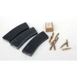 Three 5.56 magazines and inert ammunition.