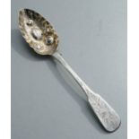 A George III Scottish silver fiddle pattern berry spoon, the gilt bowl with repousse decoration