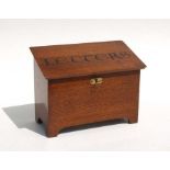 A country house style oak stationary box, with fitted interior, the lid painted "Letters" 25cm