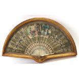 An 18th/Early 19th century Brise fan, painted with figures within a panel, mounted in a box frame,