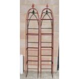 A pair of painted metal garden obelisks,186cm highCondition Reportsolid metal construction not