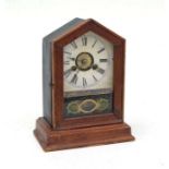 An American shelf clock, the paper dial with Roman numerals, fitted with an 8-day movement