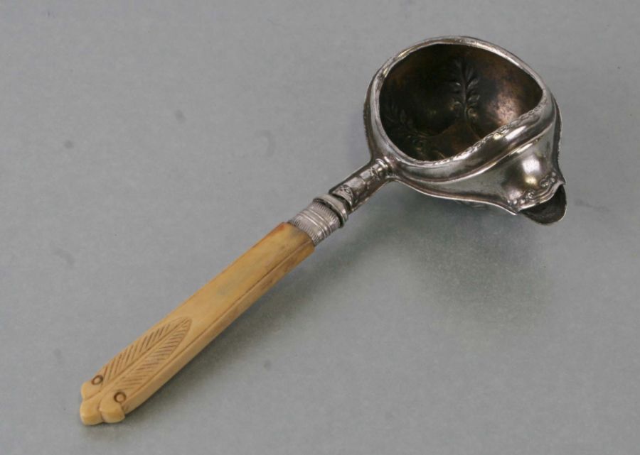 A 19th century silver plated invalid feeder with later bone handle.