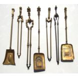 A quantity of 19th century brass and steel fire irons.