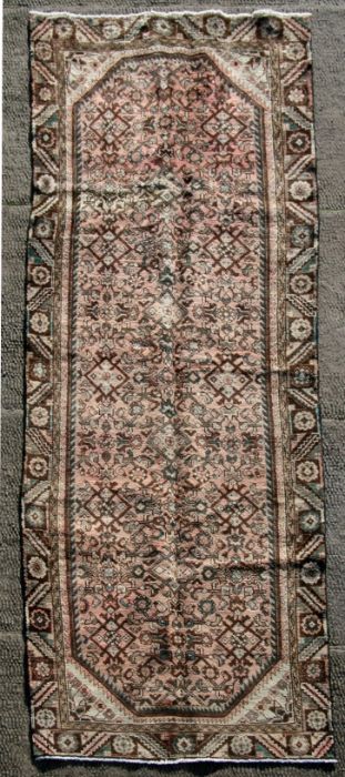 A Persian Hamadan woollen hand knotted runner, 300 by 100cms (375).