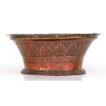 An Islamic / Moorish copper bowl of flared form with embossed decoration, 20cms diameter.