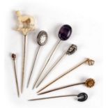 A group of Victorian and later stock pins to include a Blue John, a Scottish horseshoe and yellow