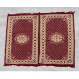 A Turkish rug with repeating geometric patterns within a multi border, on a red ground, 284 by