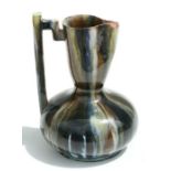A Christopher Dresser design Art pottery jug, 16cms high.