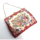 A cloisonne mounted needlepoint style ladies evening bag.