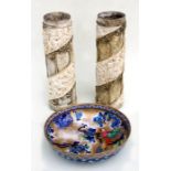 A pair of ecclesiastical style cylinder vases with moulded decoration, 36cms high; together with a