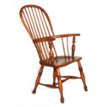 An elm stick back Windsor armchair.