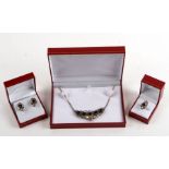 A suite of continental white metal jewellery to include necklace, earrings and ring, set with
