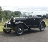 A 1928 Ford Model A Phaeton, registration no. EO 4916, black. This imposing four-seat tourer has