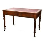A William IV style mahogany writing table with leather inset top and two frieze drawers, on tapering