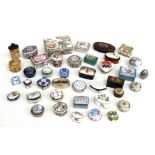 A large quantity of ceramic, enamel and other pill boxes to include Halcyon Days and Limoges