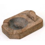 A Robert Mouseman carved oak ashtray, 10cms long.