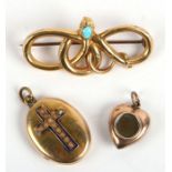 A group of Victorian unmarked gold jewellery to include a turquoise set snake brooch, a locket