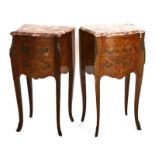 A pair of Louis XV style walnut bedside cabinets with rouge marble tops, ormolu mounts and slender