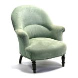 A Victorian upholstered tub armchair on turned front legs.Condition ReportHeight 84cms and width