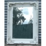 A Victorian style painted carved wood mirror with replacement plate, 122 by 90cms.