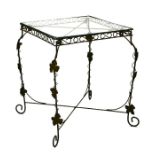 A conservatory or garden wirework occasional table with glass inset top, 48cms wide.