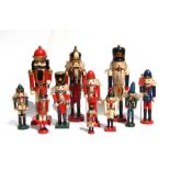 A quantity of German style nutcracker soldiers. The tallest is 37cms (14.5ins) and the shortest is