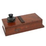 An early 20th century mahogany wall mounted telephone, the mouthpiece stamped 'No. 9', lacks