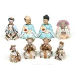 A group of late 19th century continental porcelain nodding head figures, the largest 14cms high (