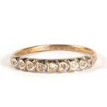 A 9ct gold ring set with nine small diamonds, approx UK size 'Q', 1.2g.