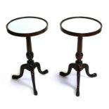 A pair of George III style mahogany wine tables with mirrored circular tops, 33cms diameter (2).